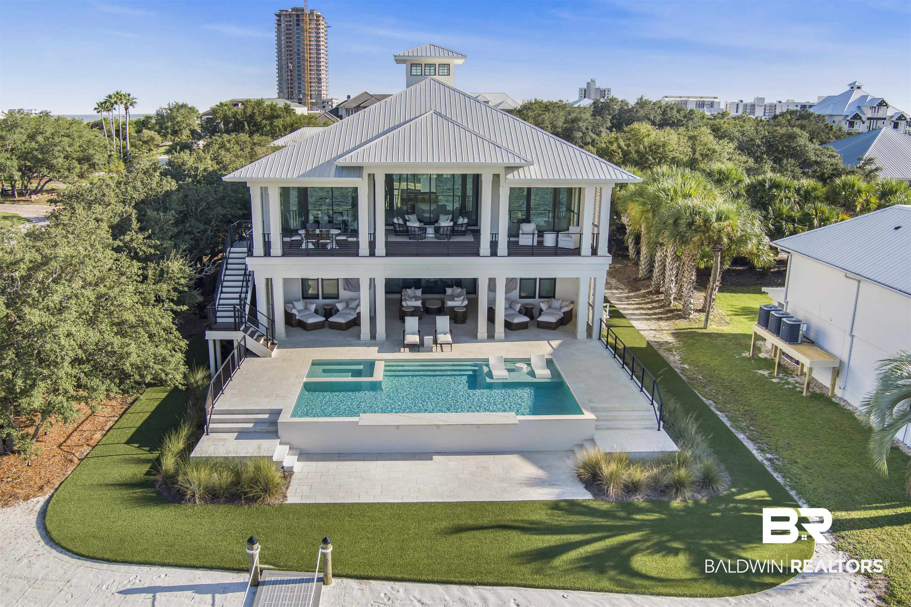 Prepare to be amazed by this stunning one of a kind waterfront residence at 3983 Oleander Ct.. Built in 2023, this property offers everything a discerning future homeowner could want. Located within half a mile of the bridge entering Ono Island, it's only a one minute drive to get back off the island. Five minutes to the Gulf by boat, in home elevator & kitchen made for cooking and state of the art security system are just a few things offered by this home. This property is a second home and has only been used a handful of times since being built. The housekeeper still comes several days a week and it is absolutely immaculate! Buyer to verify all information during due diligence.