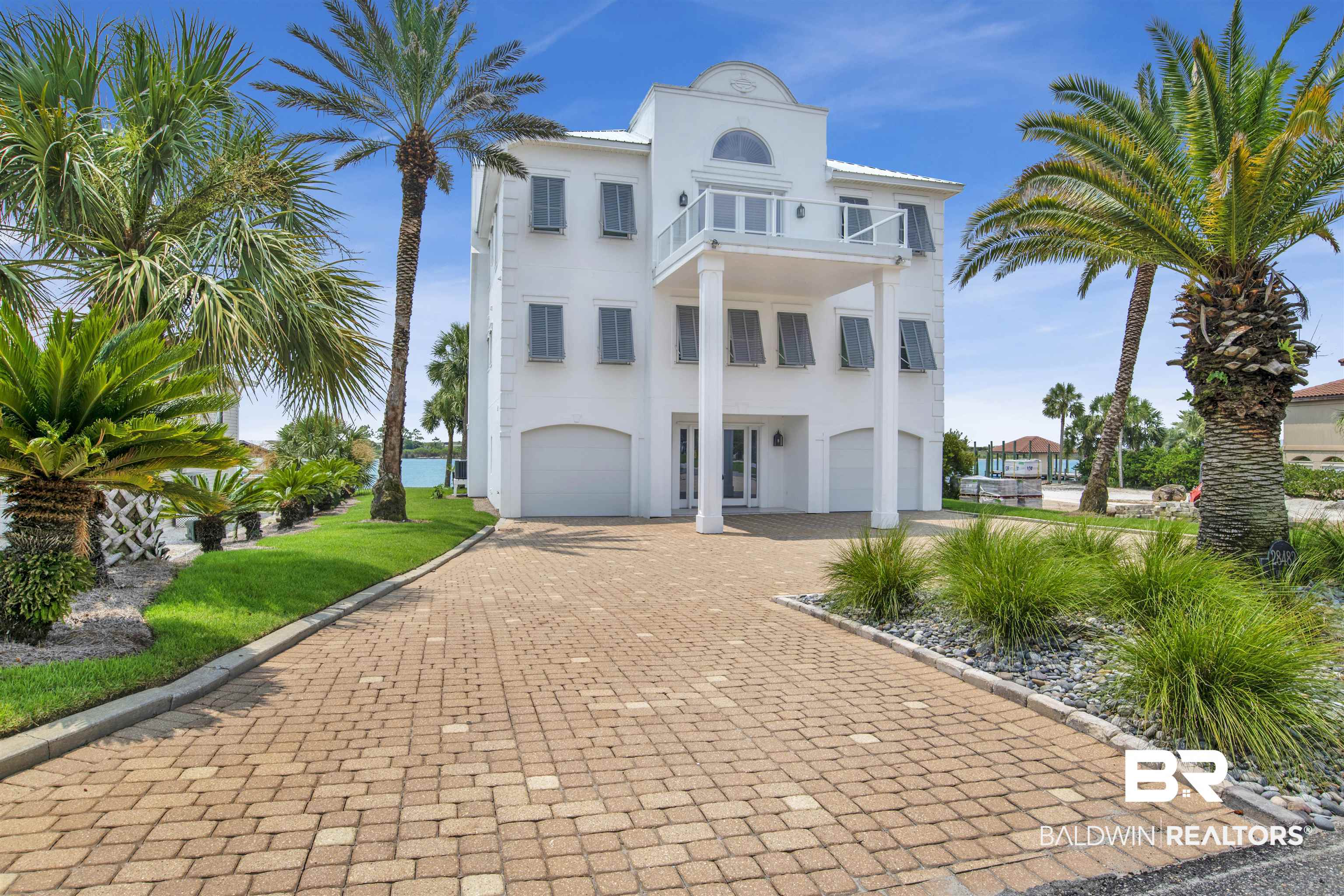 Stunning Waterfront Home with Unmatched Views in Orange Beach, AL! Welcome to 28482 Ono Blvd, a beautifully updated single-family home offering breathtaking views of Old River and the Gulf of America. This well-maintained property features new impact-rated windows and doors (just replaced), a new fortified roof, and completely renovated bathrooms, ensuring both style and durability. Inside, you’ll find a tastefully furnished interior, with many pieces curated by Melanie Martin Interiors, all of which convey with the home. A newly installed elevator provides effortless access to every level. The outdoor space is equally impressive, featuring a completely rebuilt dock with ThroughFlow decking and all-new plumbing, making it ideal for boating and waterfront relaxation. Additionally, pool renderings are available should the buyer wish to add a pool, offering the potential to further enhance the property. Situated near the Ono Island entrance gate, this home combines privacy with convenience, allowing for quick and easy access on and off the island. Whether you’re looking for a full-time residence or a luxury waterfront investment, this exceptional property is a must-see! Buyer to verify all information during due diligence.