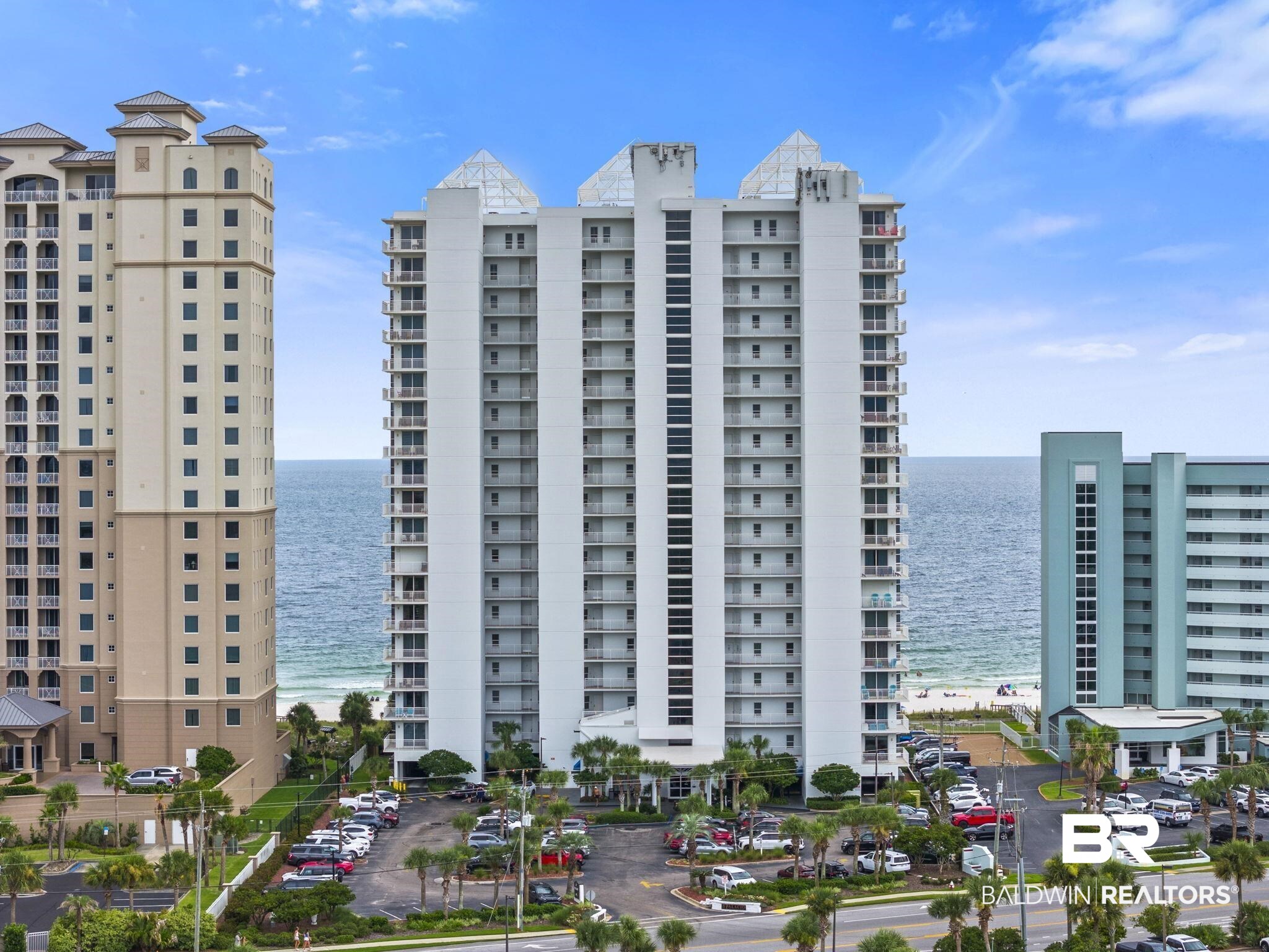 Experience the ultimate Gulf Coast lifestyle in this excellent 3BR/3BA west end residence at Palacio on Perdido Key! Floor-to-ceiling windows and sliding glass doors frame sweeping vistas and those legendary Perdido sunsets you'll never tire of watching. Enjoy views of Perdido Key as far as the eye can see... it’s a front row seat to everything the Gulf Coast has to offer! Inside, handsome travertine tile flows through the main living areas and into the kitchen, where matching travertine surfaces, a tiled backsplash, and a stylish breakfast bar create a space that's as functional as it is beautiful. A charming breakfast nook with a picture window invites morning light, while a dedicated wet bar opposite the dining area makes entertaining effortless. The generous Primary Suite offers space for a sitting area, complemented by a separate dressing vanity just outside the main bath. Guests can enjoy their own ensuite bedroom at the opposite end of the condo, complete with a balcony overlooking the north end of Perdido Key. The third bedroom is a welcoming space for family, friends, or whoever is lucky enough to visit. Palacio's resort-style amenities include a Gulf-front outdoor pool, heated lap pool, hot tub, tennis courts, fitness center, conference room, outdoor grilling stations, as well as a pet walk area for owner’s pets. Owners also enjoy the added benefit of COVERED GARAGE PARKING. Beyond the Palacio complex, you're just minutes from great golf, fresh seafood, boating, and local shopping. The National Museum of Naval Aviation, Pensacola Lighthouse, and Fort Barrancas are all just a short drive away. Buyer to verify all information during due diligence.