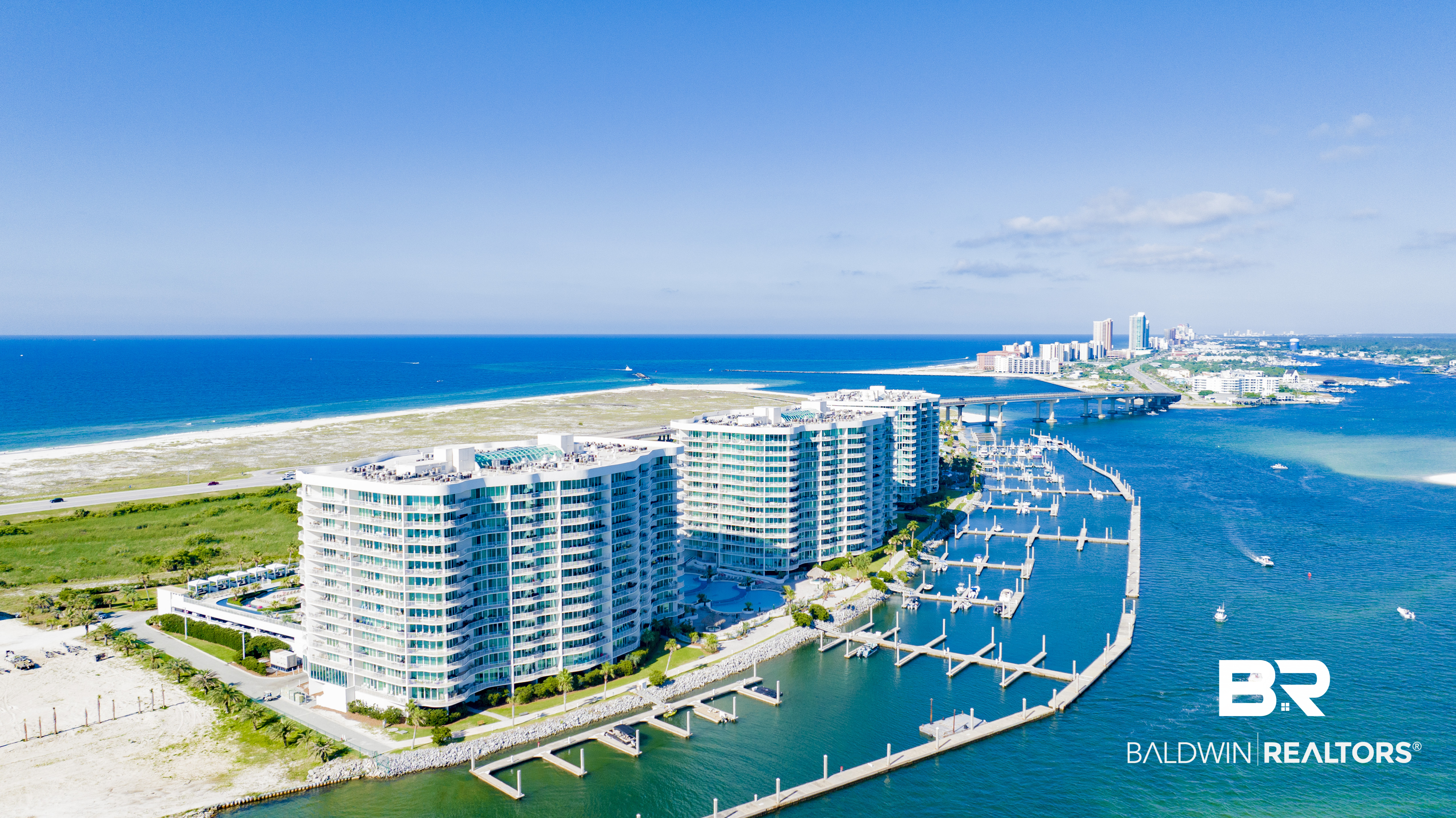 Experience the best of coastal living in this beautifully renovated 3/3 condominium at Caribe Resort in Orange Beach. Offering 1,839 square feet of thoughtfully designed living space, this fully furnished residence combines luxury, comfort, and investment potential.Recent renovations include new cabinetry, quartz countertops, and elegant wood look tile plank flooring throughout. Professionally decorated with coastal inspired finishes, this move in ready condo offers a bright,  atmosphere from the moment you enter. One of the best features of this D Building unit is its convenient first floor location, providing quick access without waiting on elevators. The ceilings on this first floor unit are approximately two feet higher than those on upper levels, creating a spacious, open feel that enhances the natural light throughout the home.The expansive private balcony showcases sweeping views of St. John, Old River, Ono Island, and the resort's signature amenities, including the waterslides, lazy river, pools, cabanas, and tiki bar offering a front row seat to the vibrant resort lifestyle.The spacious primary suite, well appointed guest bedrooms, and open concept living and dining areas make this condo equally suited for personal enjoyment or welcoming vacation guests. Whether you're searching for a full-time residence, a coastal retreat, or a high-demand vacation rental, this property offers exceptional flexibility.Caribe Resort is one of Orange Beach's premier waterfront destinations, featuring multiple indoor and outdoor pools, a lazy river, waterslides, fitness center, sauna and steam rooms, basketball and tennis courts, miniature golf, on-site dining, marina access, boat slips, beach trolley service, and convenient beach access. Additional updates include a new water heater installed in 6/26 and a new HVAC system scheduled for installation by the end of 7/26, new Paint throughout and all custom window treatments and owner's closet. Buye Buyer to verify all informatio Buyer to verify all information during due diligence.