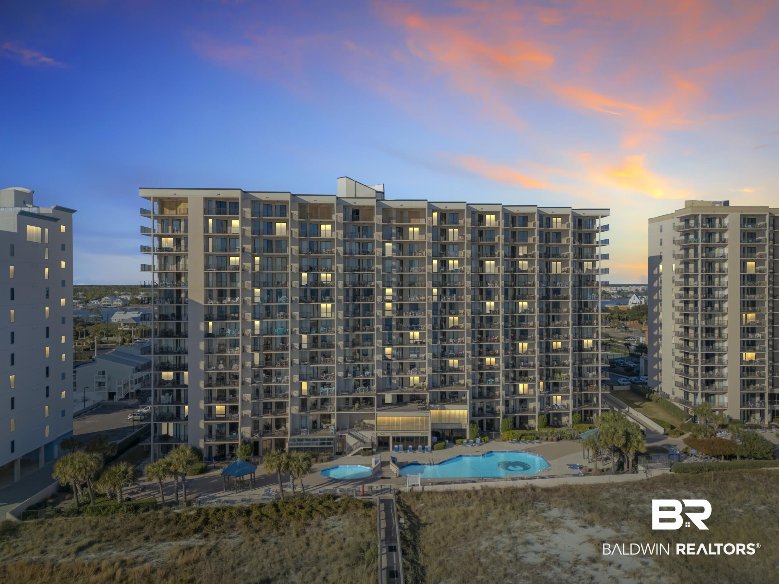 Experience the ultimate blend of convenience, comfort, and coastal living in this beautifully positioned corner condo unit. Perfectly situated on the same level as the resort-style pool and splash pad, this residence offers effortless access to fun in the sun—Simply step out and you’re there. Being a corner unit, you’ll enjoy added privacy, extra natural light, and an open, airy feel throughout the space. The thoughtfully designed layout maximizes both comfort and functionality, making it ideal as a primary residence, vacation retreat, or investment property. The community amenities elevate the experience even further. Spend your days lounging by the sparkling pool, watching the kids enjoy the splash pad, or taking a short stroll to the pristine Gulf beach. And the best part? Because you’re already on the same level as the pool deck and beach access point, you can skip the crowds waiting for elevators and get straight to relaxing.Whether you’re soaking in Gulf breezes from your private space or enjoying the vibrant atmosphere of the property’s outdoor amenities, this condo delivers the easy, carefree beach lifestyle you’ve been dreaming of.