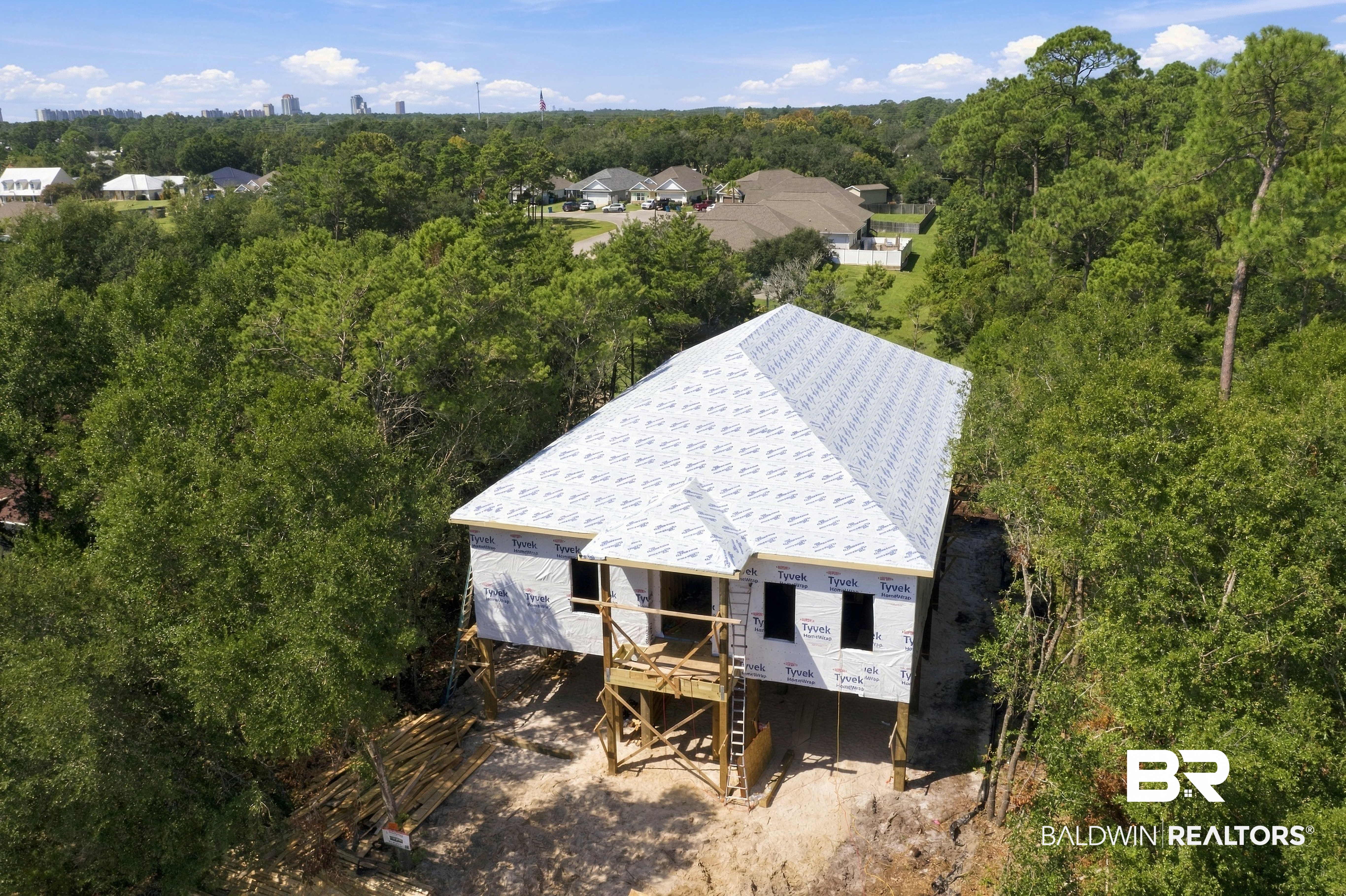This is a Coming Soon Listing. New construction by CG Construction in Terry Cove Harbor, this 5 bedroom, 4.5 bath home is built to FORTIFIED Gold standards in no flood zone, offering 3,724 sq ft of heated living space and 6,279 sq ft total under roof. The ground level features an entry area with a bonus flex space, 2 bedrooms, a full bath, and additional outdoor storage. The main level features 12 foot ceilings, the primary suite, laundry room, a secondary primary suite with a double vanity, an additional bed and bathroom, a hallway half bath, detailed ceiling treatments, and an existing elevator shaft.The kitchen includes ZLINE appliances, a 48 inch gas range, a 10.5 foot waterfall island, and butler's pantry. The covered back porch is accessible from both the family room and the primary suite via sliding doors, with his and hers walk in closets and a wet shower and tub in the primary suite. Selections are still being finalized at this time, so depending on timing, a buyer may have the opportunity to weigh in on select finishes. Estimated completion: February 2027.